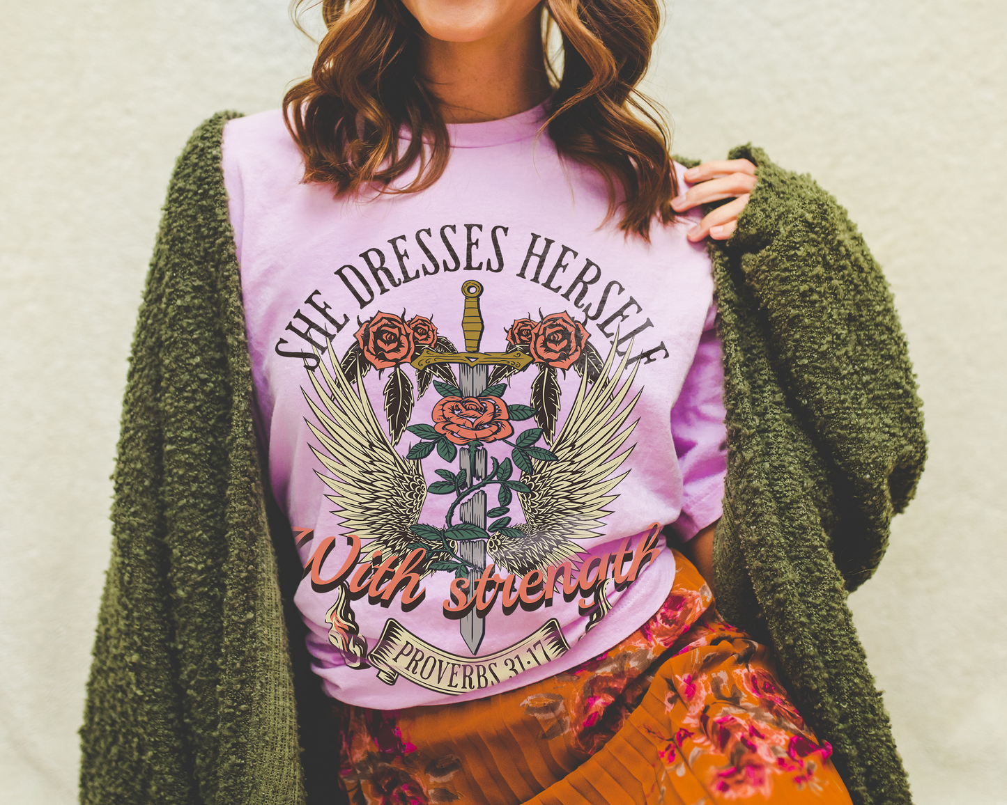 she dresses herself with strength